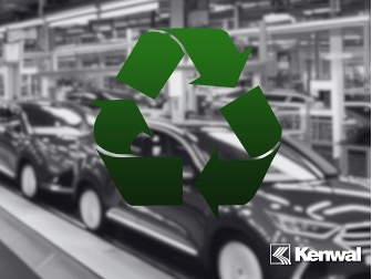 An out-of-focus, black-and-white scene of a car manufacturing line, and showcased at the center is a gradient green reduce, reuse, recycle symbol. The bottom right corner has the Kenwal logo in white.